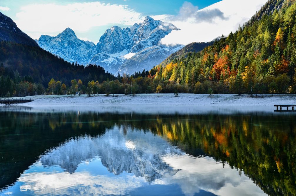 Lake Jasna in autumn with the backdrop of the Julian Alps