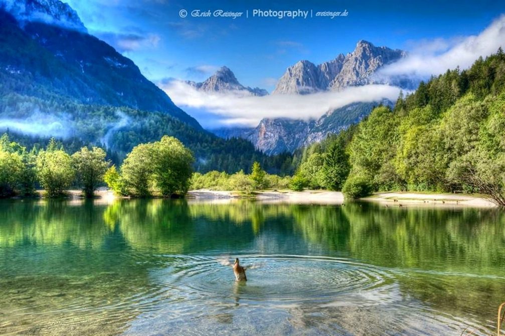 Lake Jasna with an enviable backdrop of the Julian Alps looking towards Vrsic Pass