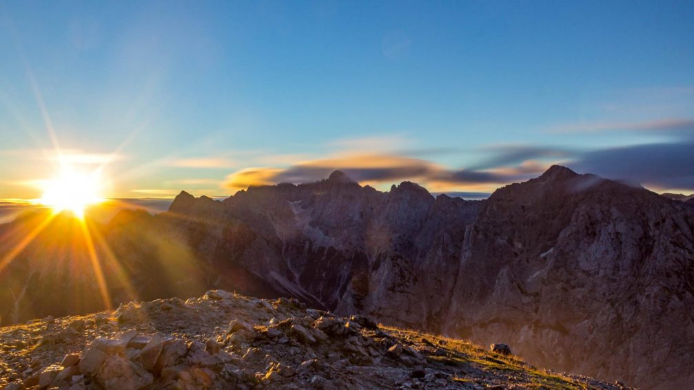 A beautiful sunrise in the Julian Alps as seen from the Mala Mojstrovka summit