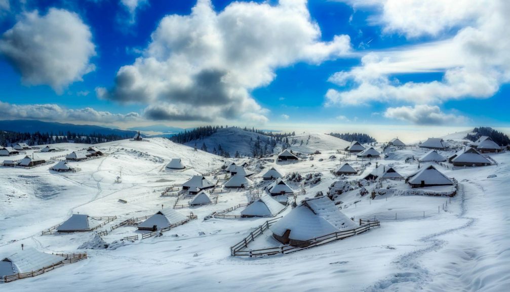 The Velika Planina high-elevation Alpine settlement in winter with lots of snow