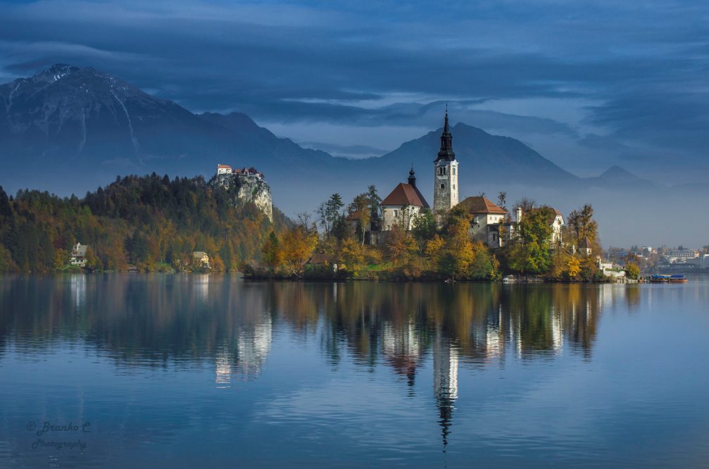 Lake Bled in Slovenia with a postcard-perfect church and a castle clinging to a cliff