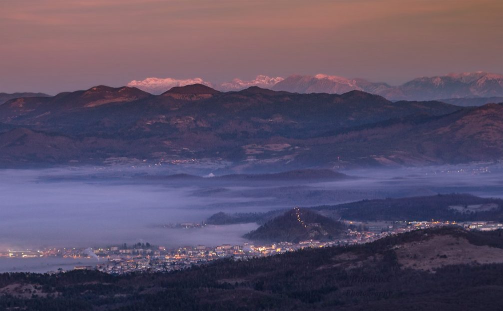The town of Postojna in southwestern Slovenia with the Julian Alps in the background