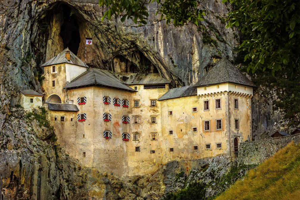 Predjamski Grad Castle perched in the middle of a cliff near Postojna, Slovenia