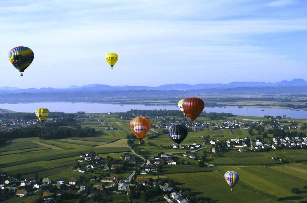 An aerial view of the hot air balloons above the Dravsko Polje in Slovenia