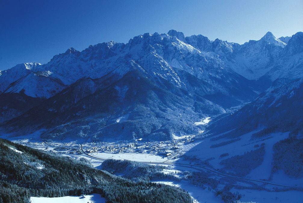 An aerial view of the alpine village and ski resort of Kranjska Gora in winter