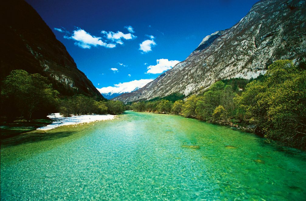 The Soca River flowing through the Trenta valley in Slovenia