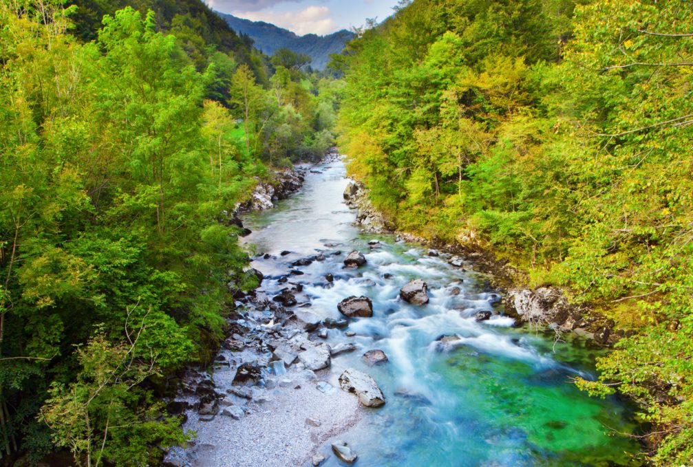 The Idrijca river flowing through the Idrija Hills in western Slovenia