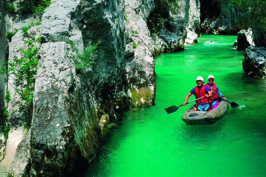 Rafting through the Great Gorge of the Soca River in the Trenta Valley in Slovenia