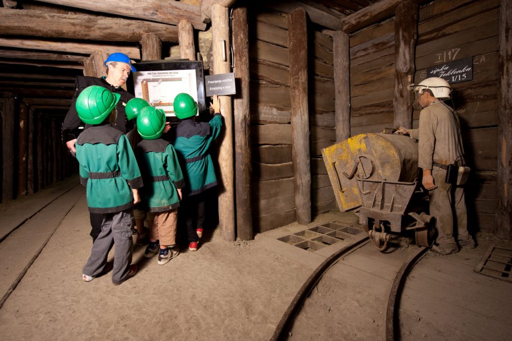 Visitors and life-size puppets of miners in the Idrija tourist mine in Slovenia