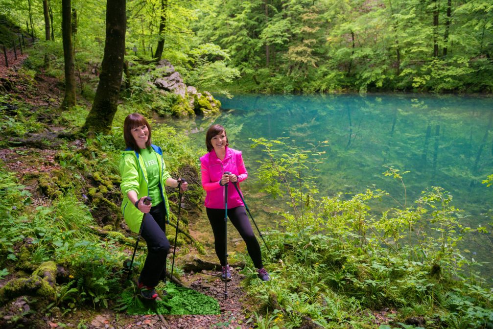 Two female hikers at the Wild Lake in the Idrija area of Slovenia