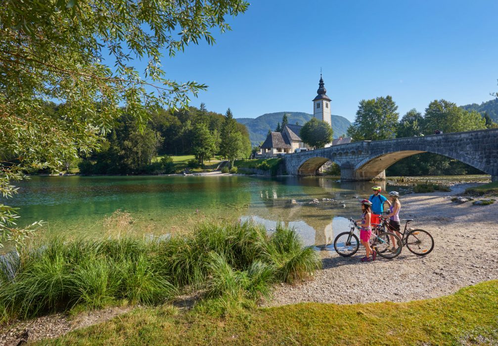 A family stop to take in the view of Lake Bohinj in Slovenia