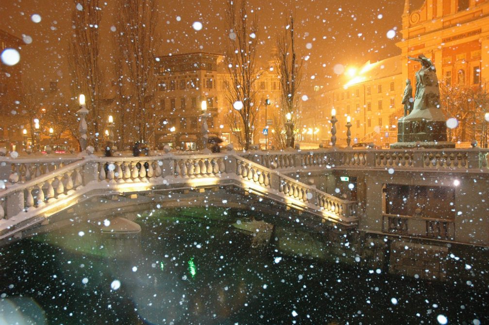 Triple Bridge in the Old Town centre of Ljubljana during snowfall in the winter