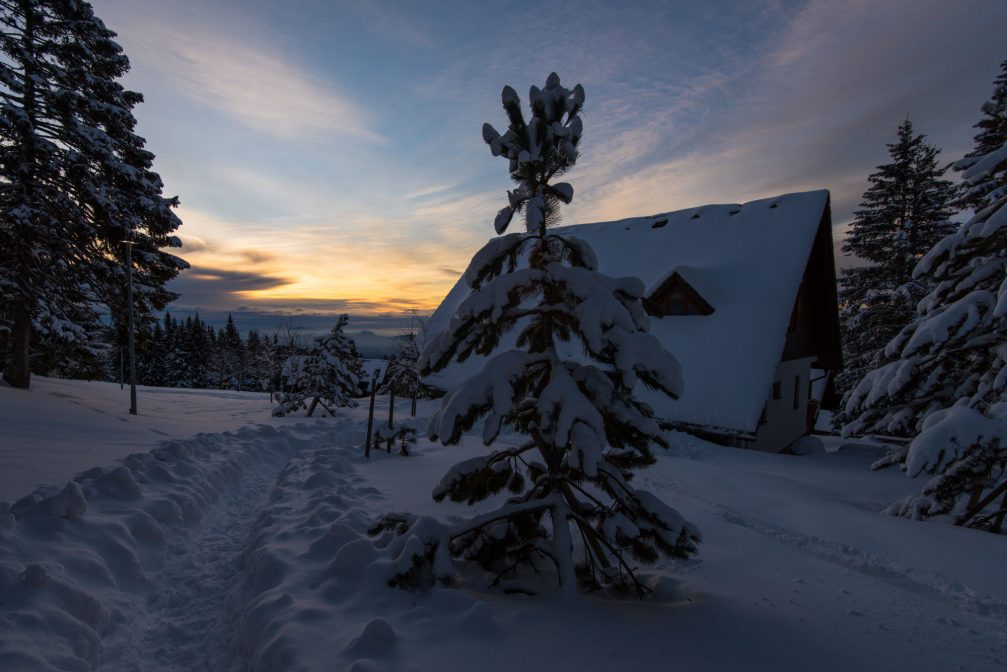 A lonely cottage on the Rogla mountain in the winter with plenty of snow