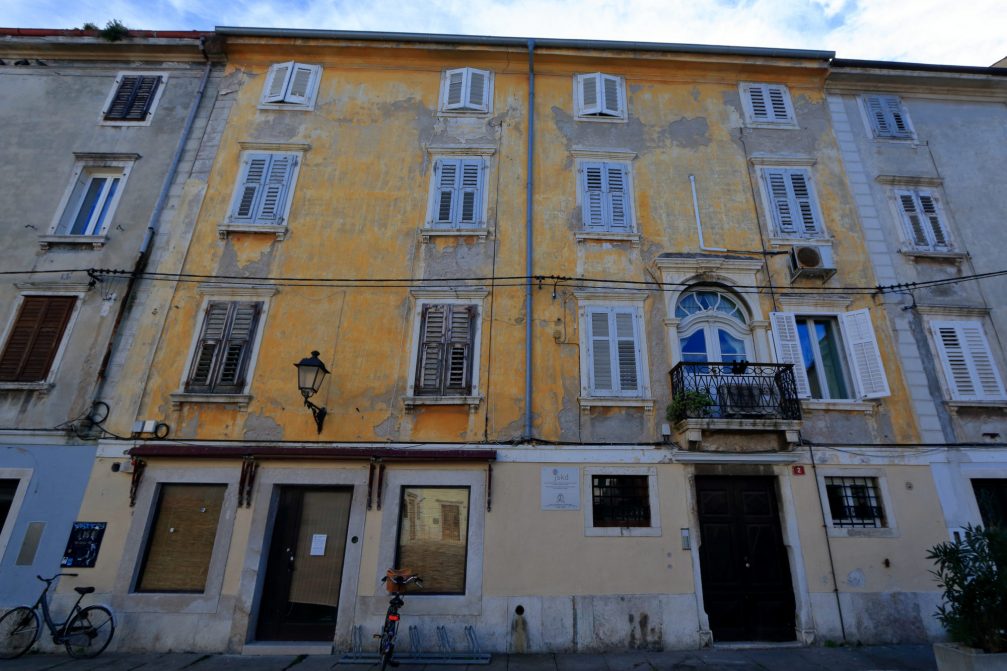 A building surrounding the First of May Square in Piran in need of a make-over