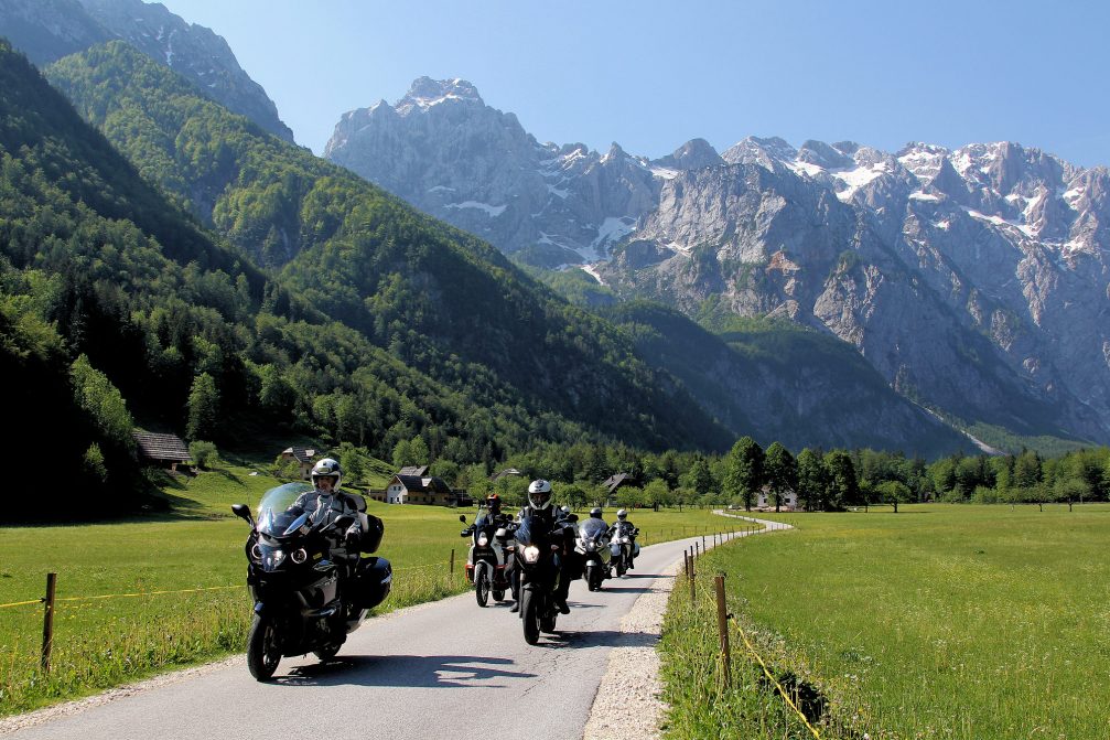 A group of motorcyclists on the road through the Logarska Valley and Landscape Park in the Solcava area in Slovenia