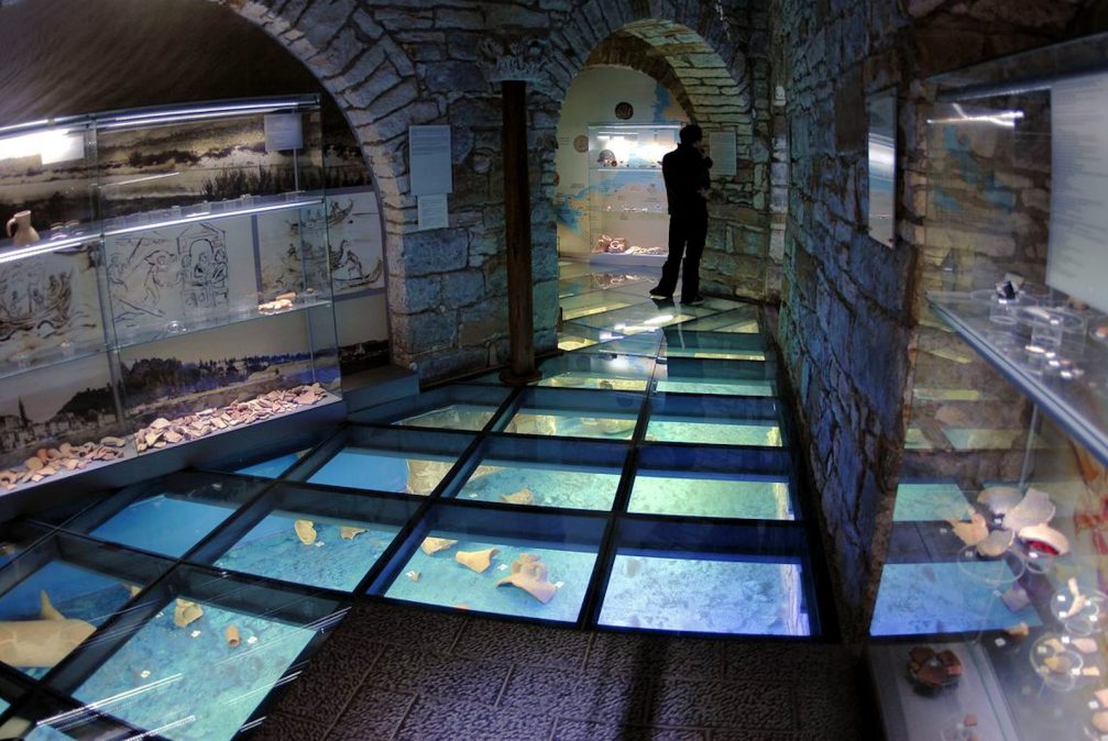 A room with a glass floor in the Sergej Masera Maritime Museum In Piran