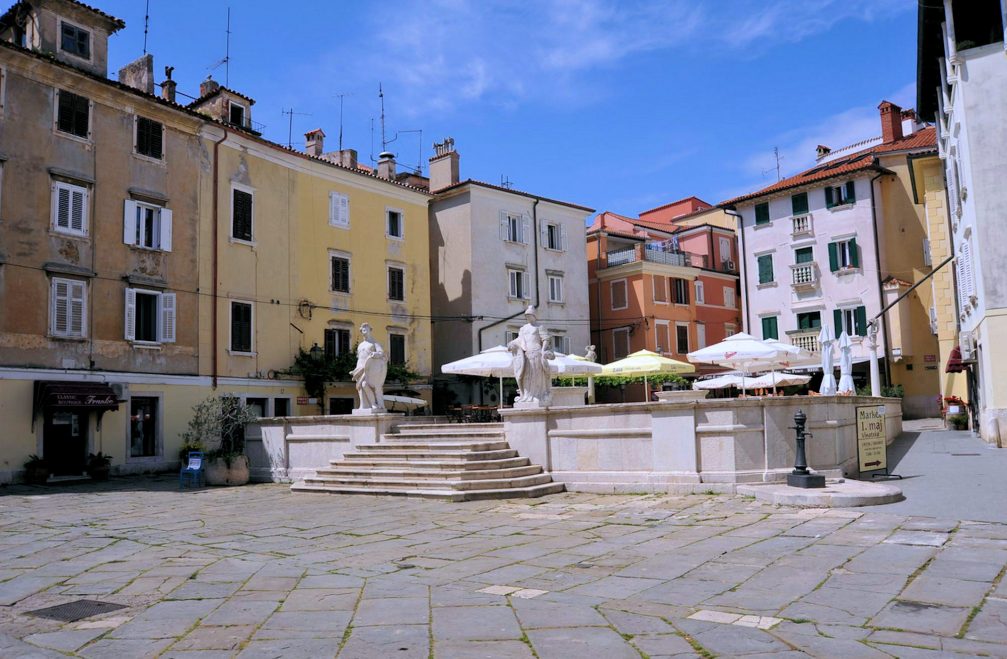 Piran’s First Of May Square on a summer day with almost clear blue sky