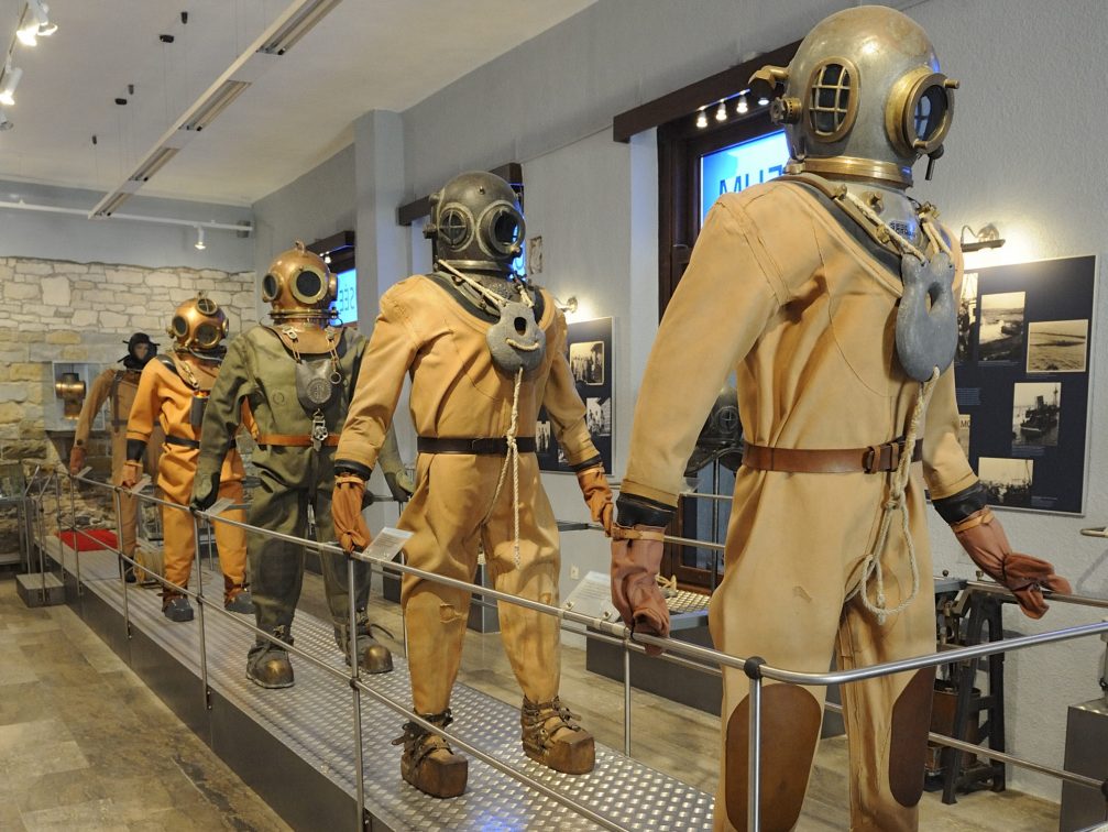 Display of deep-sea diving suits and helmets at the Museum Of Underwater Activities Piran