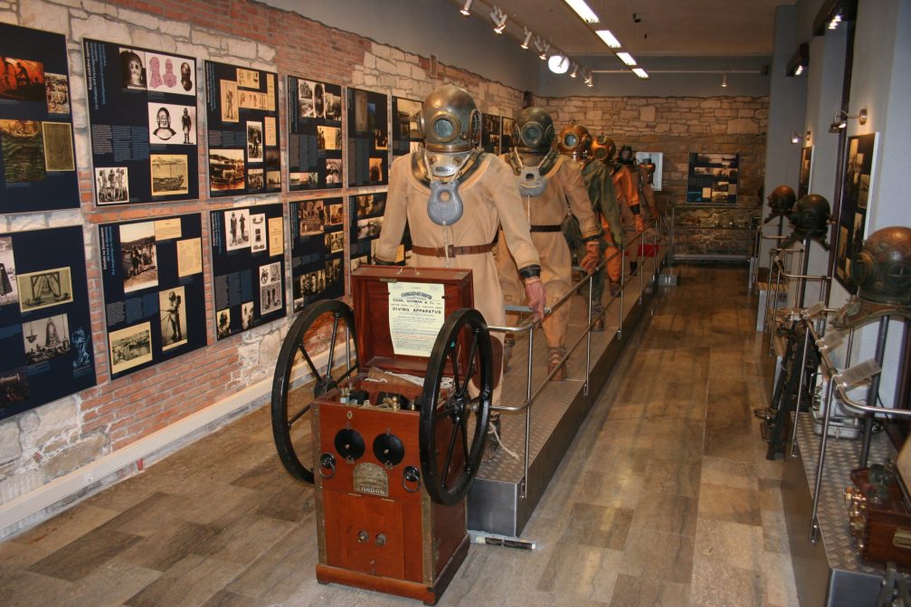 Old deep-sea diving suits and helmets at the Museum Of Underwater Activities Piran in Slovenia