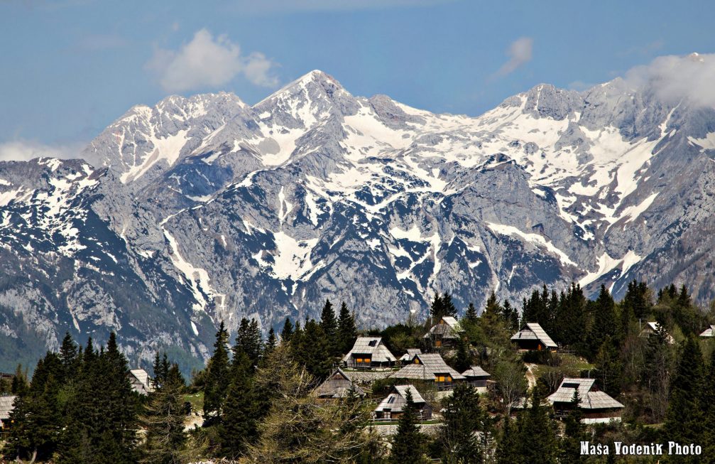 A view from Velika Planina towards the snow capped mountains of the Kamnik-Savinja Alps 