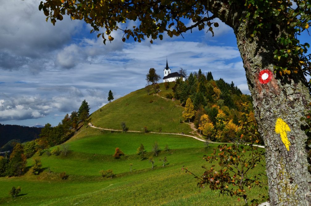 The Church of St. James on the Sveti Jakob hill in the Polhov Gradec Hill Range in central Slovenia in autumn