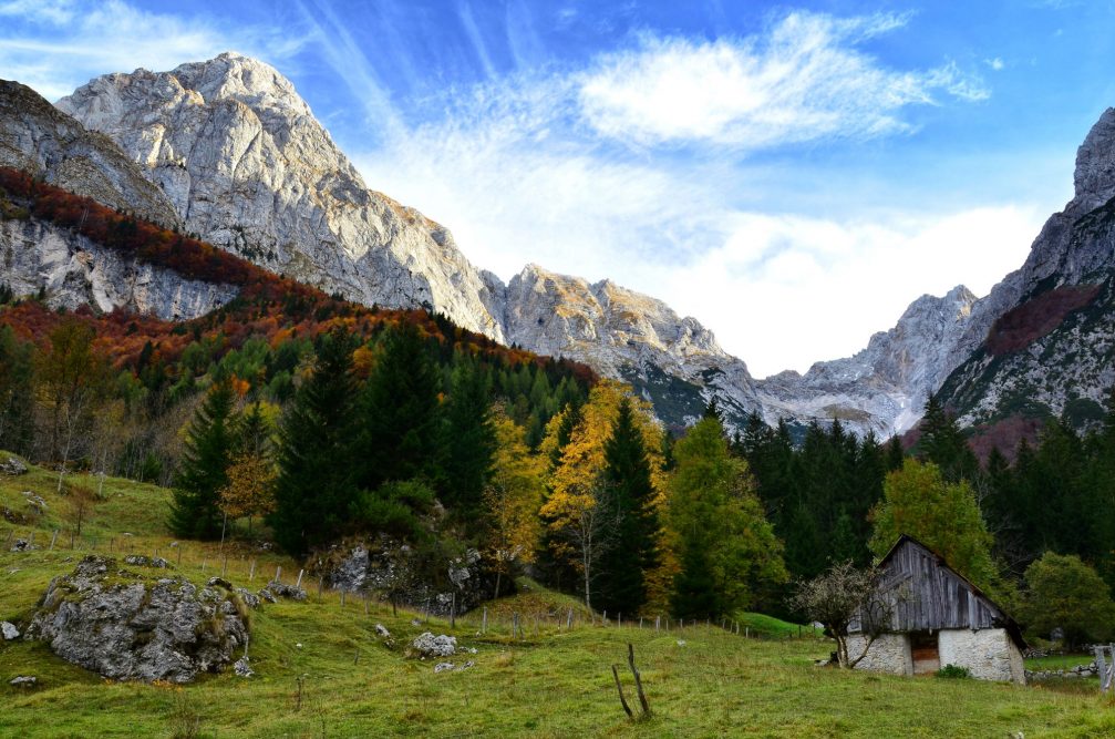 Trenta valley surrounded by majestic peaks of the Julian Alps in autumn