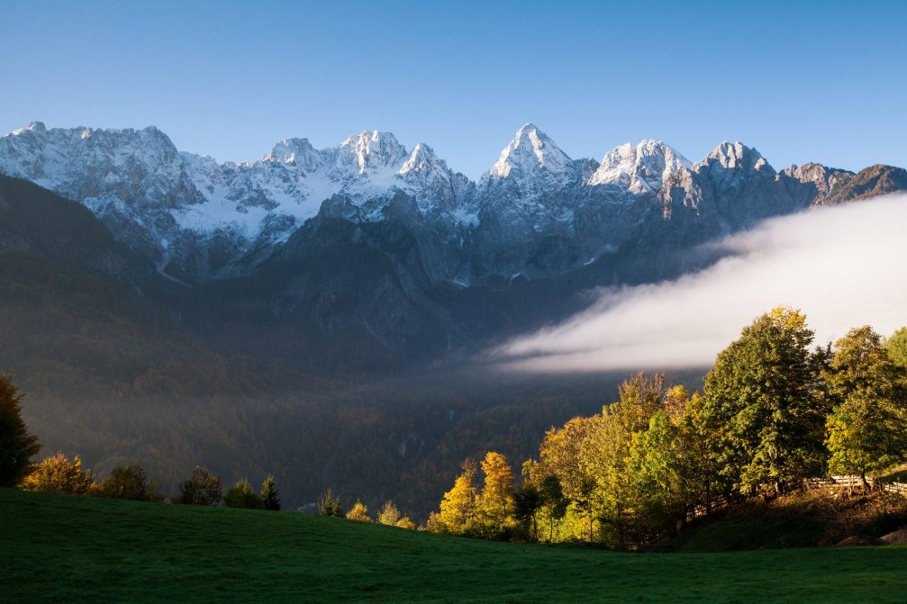 The snow capped Martuljek mountain chain in the Julian Alps in autumn