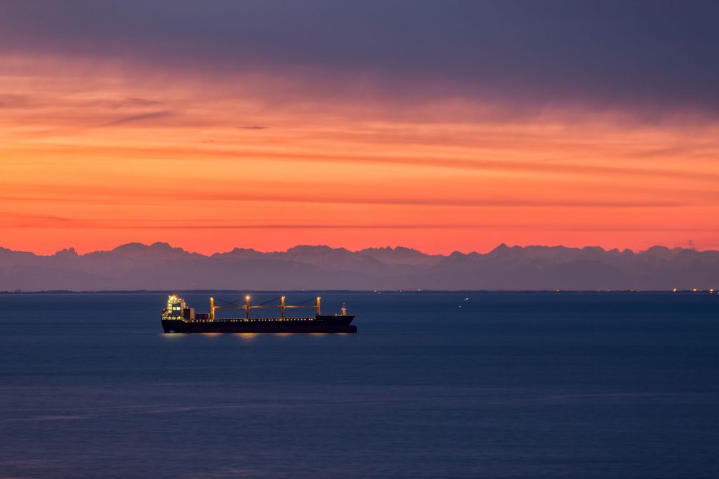 Cargo ship anchored in the Koper bay in Slovenia at sunset