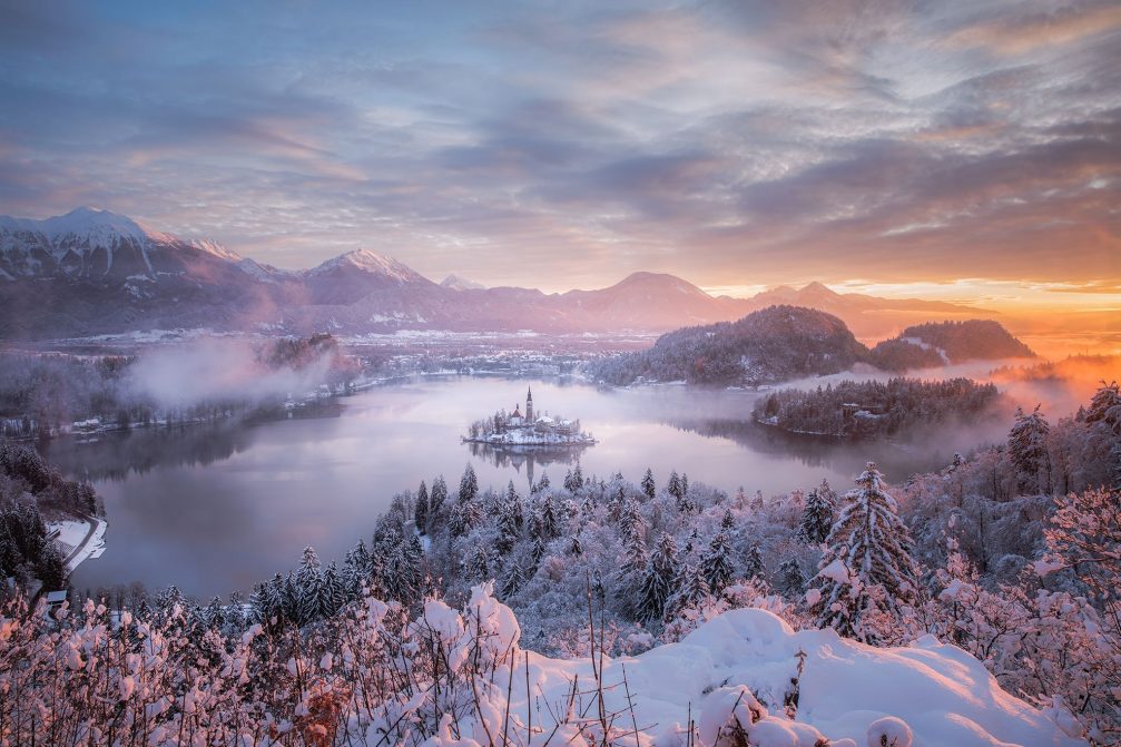 Sunrise above the snow-covered Lake Bled, Slovenia in the winter time