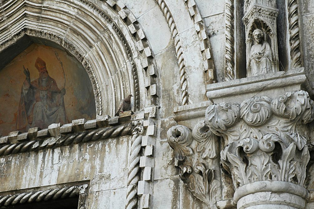 A lunette and a capital on the exterior of the Cathedral of St. Mary's Assumption In Koper, Slovenia