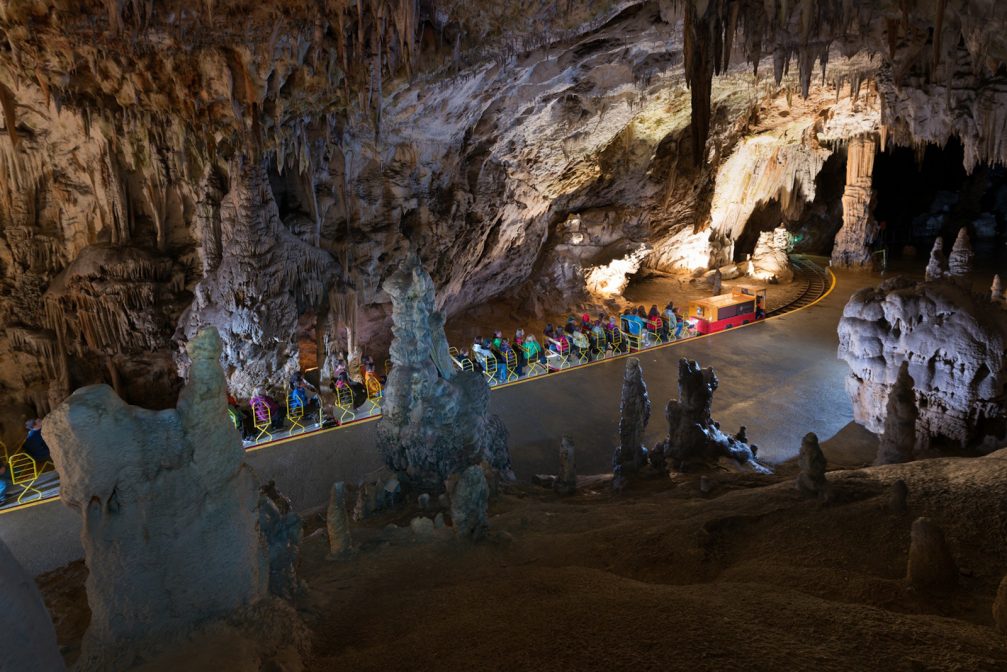 Elevated view of the electric train inside Postojna Caves in Slovenia