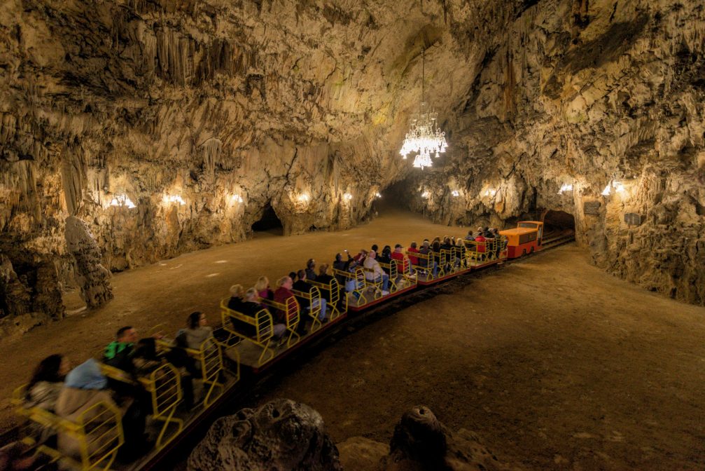A train at the Dance Hall inside Postojna Caves in Slovenia