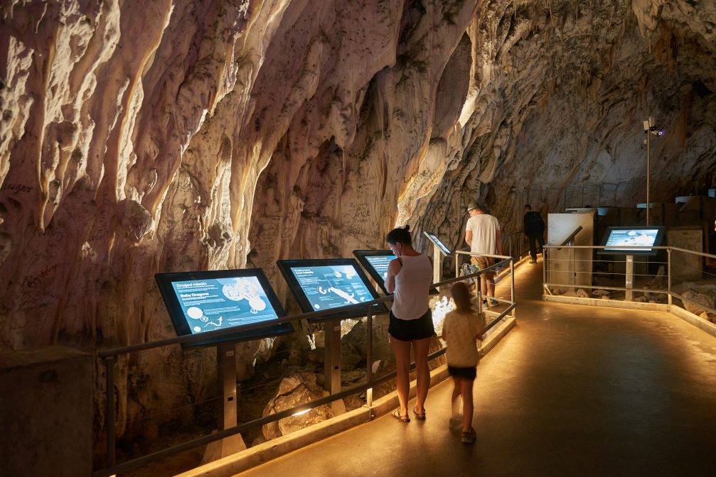 Info plaques inside the Postojna Cave in Slovenia