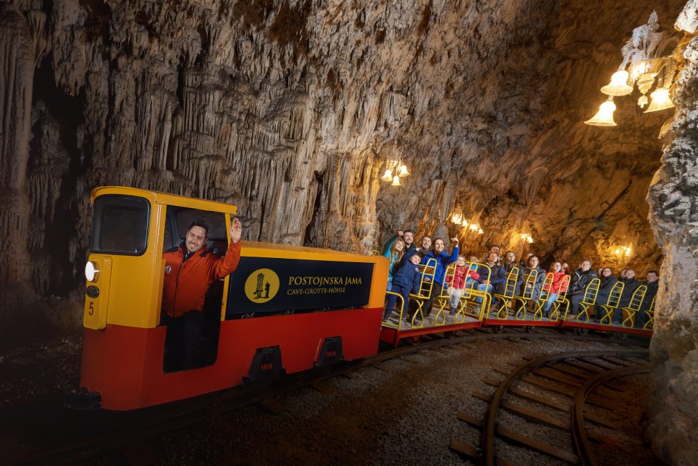 A train with visitors inside Postojna Caves in Slovenia