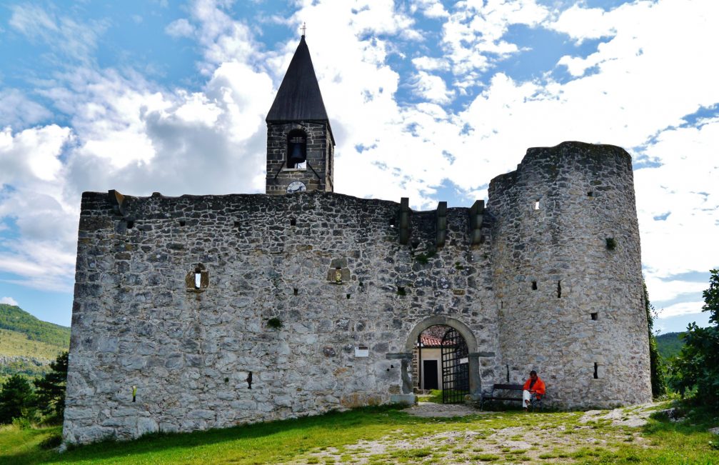 View of the Holy Trinity Church and its wall in Hrastovlje, Slovenia