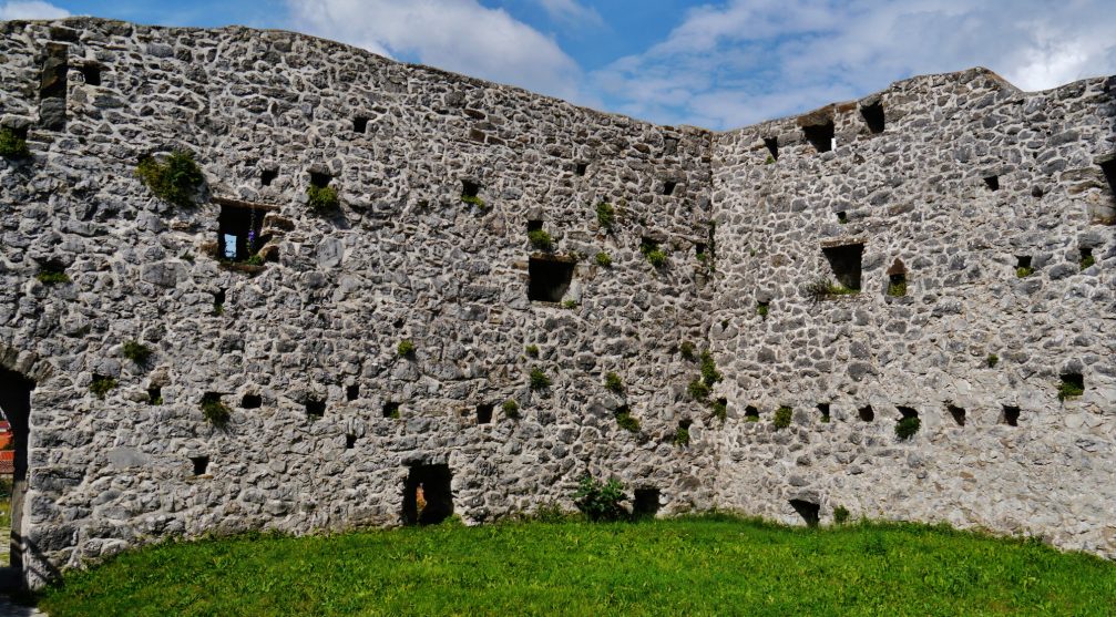 The wall enclosing the Holy Trinity Church in Hrastovlje, Slovenia