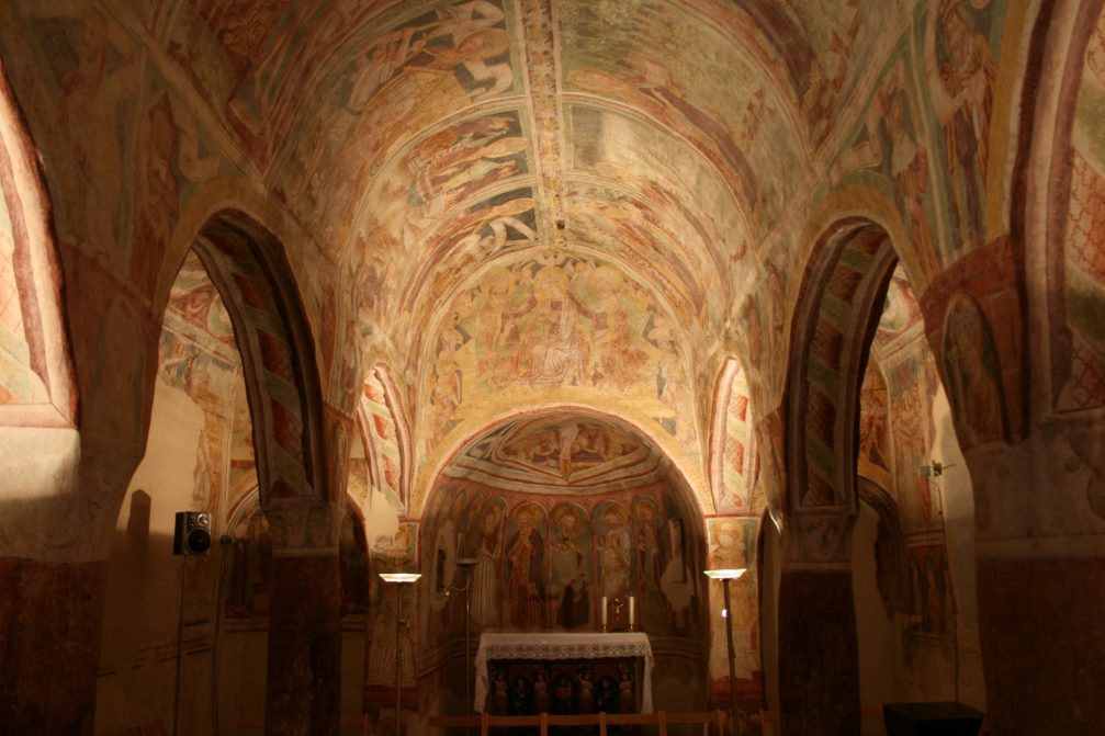 The interior of the Holy Trinity Church in Hrastovlje is adorned with frescos