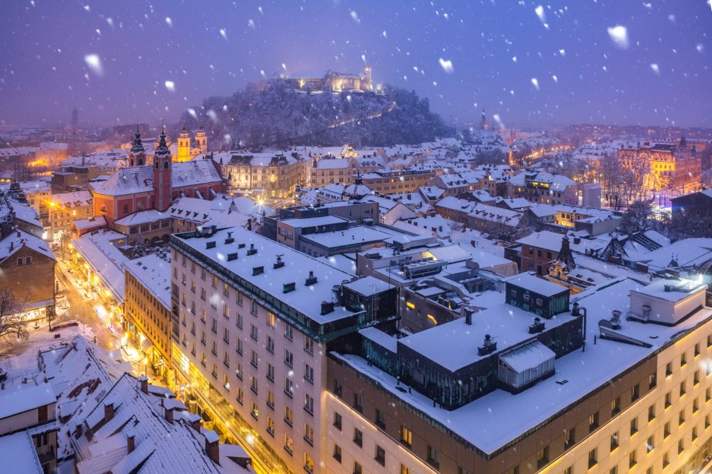 Slovenia's capital Ljubljana covered in snow in the winter time from the Neboticnik skyscraper