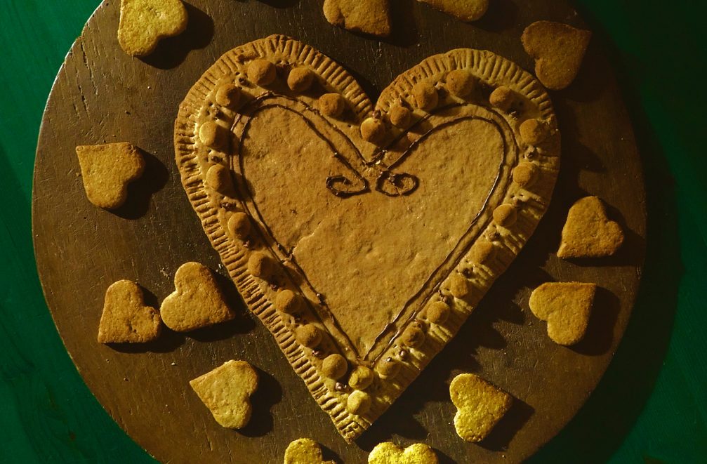 Festive happy cookies in the shape of a heart