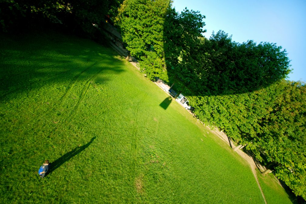 A shadow in the shape of a heart from a hot air balloon