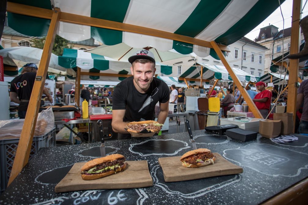 A Slovenian chef preparing sandwiches at the Open Kitchen gourmet street food market in Ljubljana