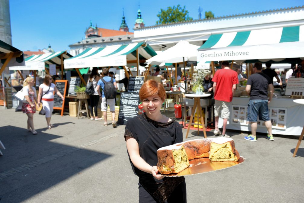 A woman holding Potica in Ljubljana, the capital of Slovenia