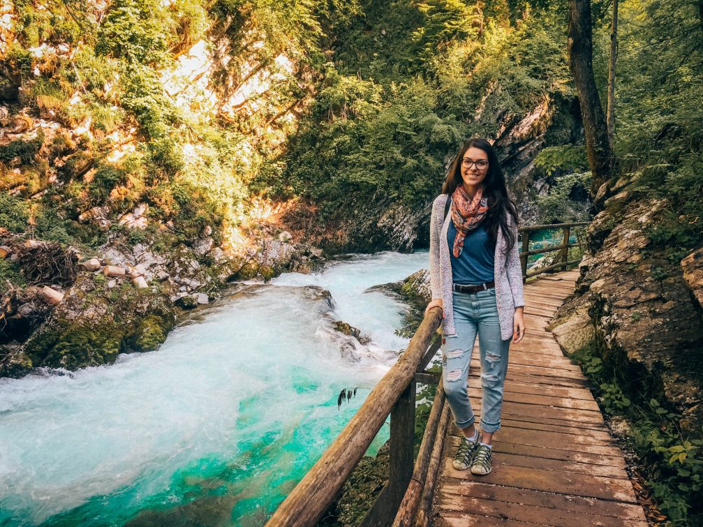 Travel blogger Aurelia Teslaru from Daily Travel Pill posing at the Vintgar Gorge in Slovenia