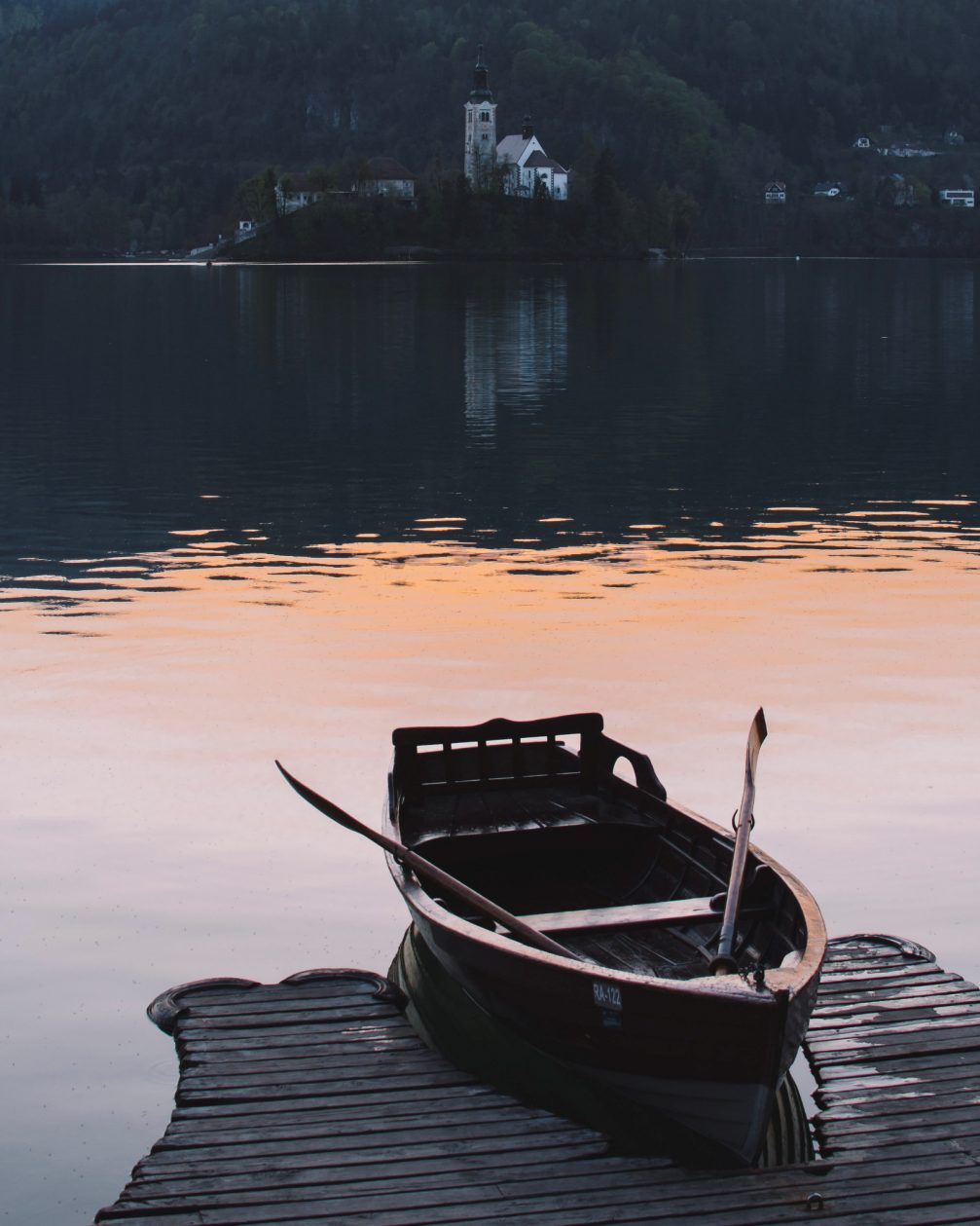 A lonely boat on a jetty at Lake Bled in Slovenia