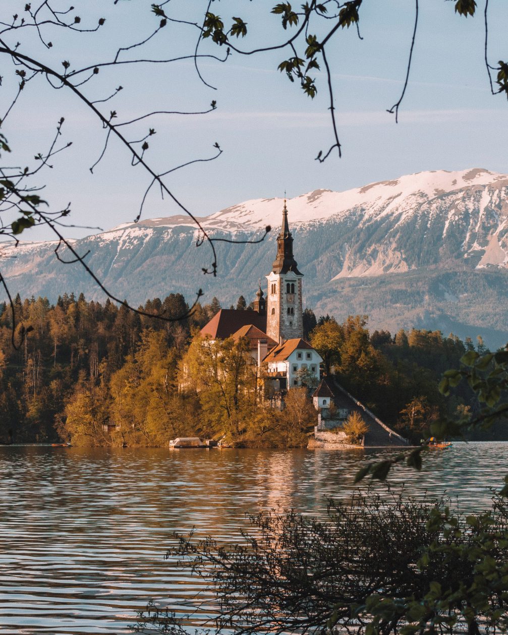 An island with a church in the middle of Lake Bled in Slovenia