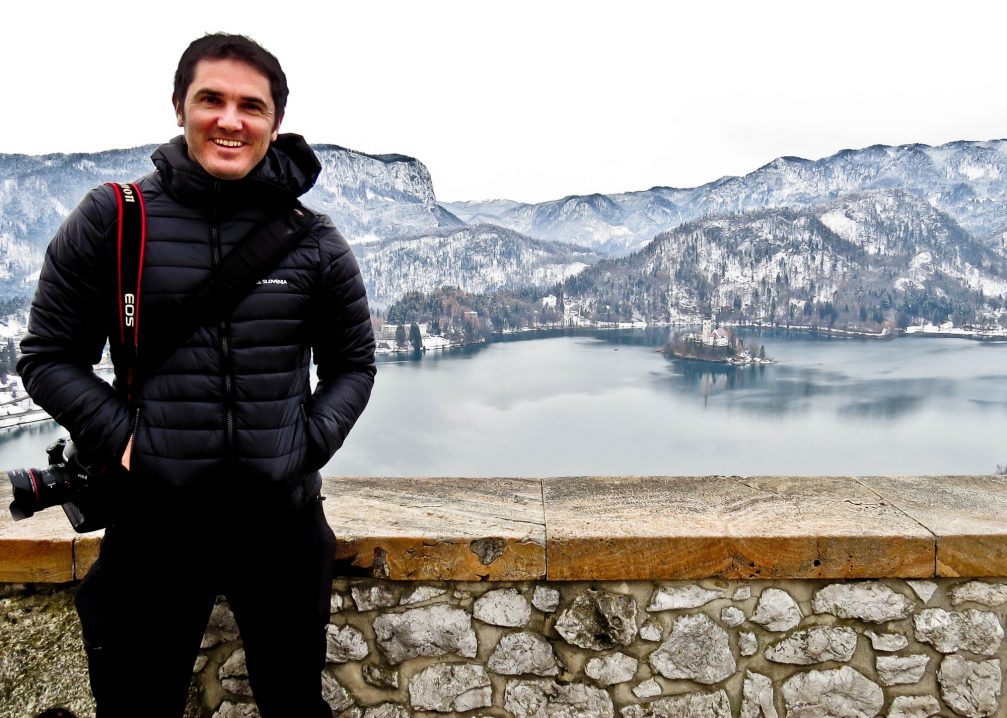 James Smith at the Bled Castle with Lake Bled and the Slovenian Alps in the background