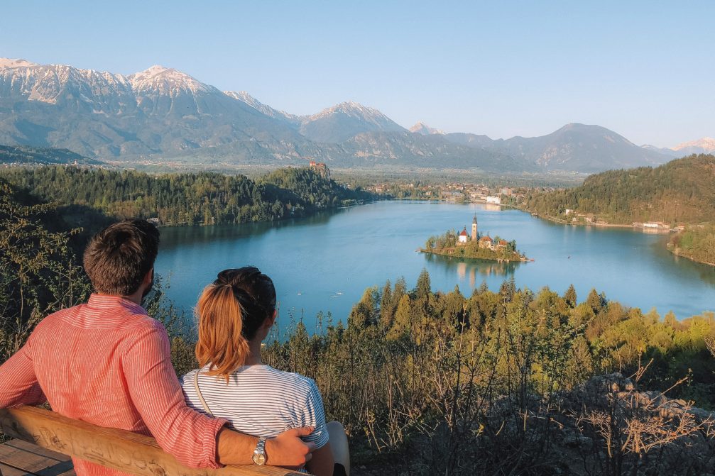 A couple enjoying a view of Lake Bled in Slovenia