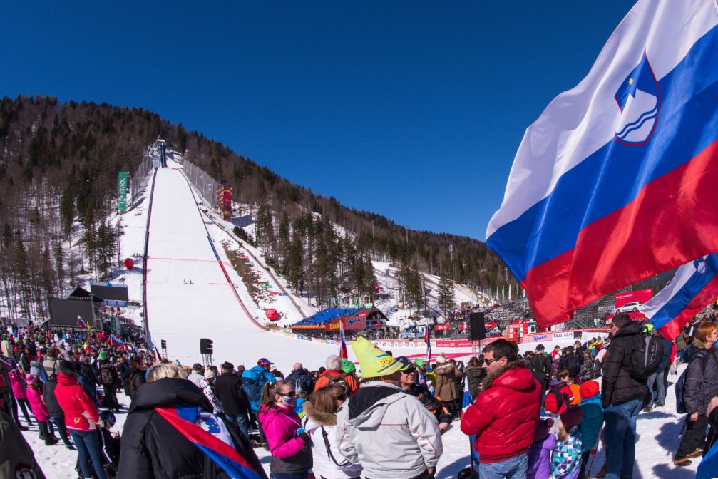 Planica ski flying hill with lots of people watching  FIS Ski Jumping World Cup Final