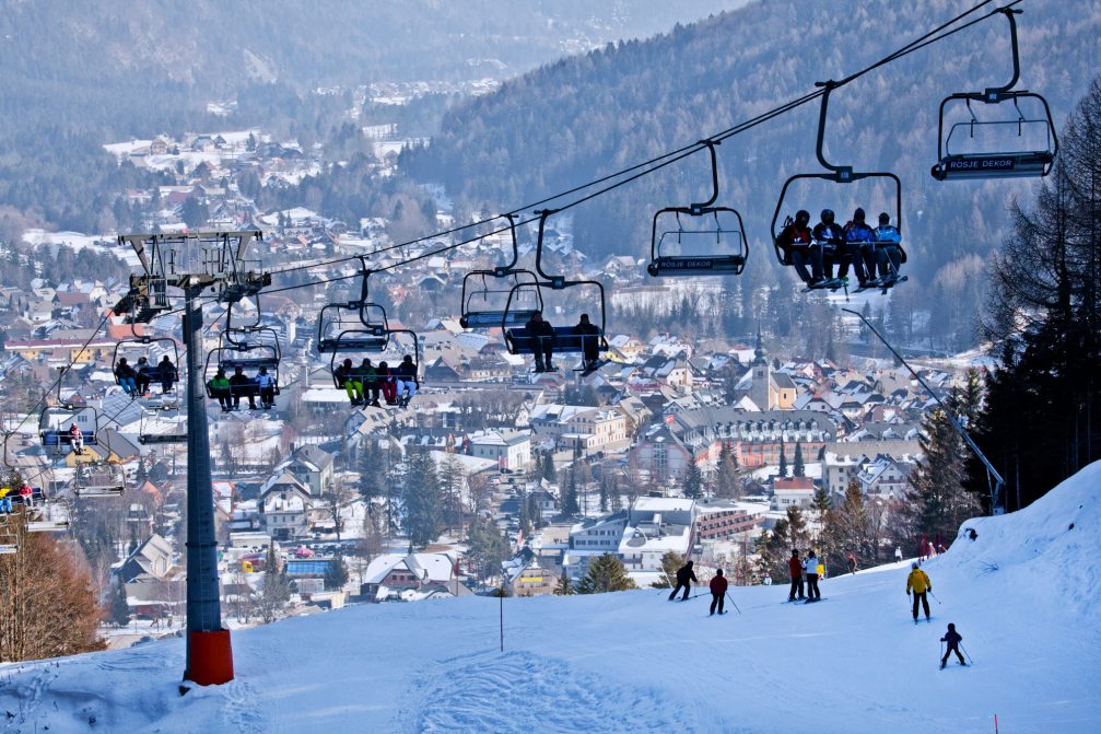 Chair lifts at Kranjska Gora Ski Resort and the village of Kranjska Gora, Slovenia