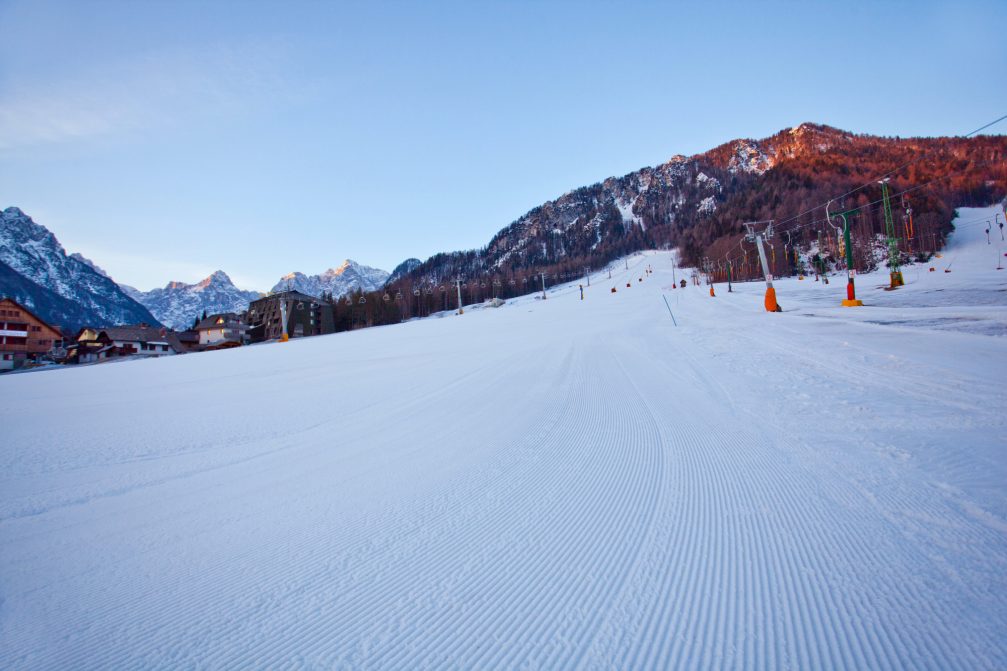 Kranjska Gora Ski Resort on a sunny winter morning with clear blue sky